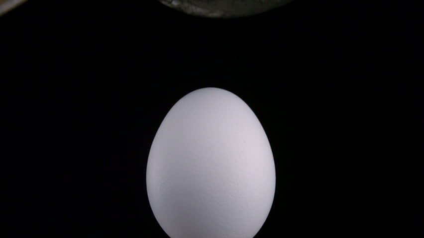 Iron mallet smashes egg