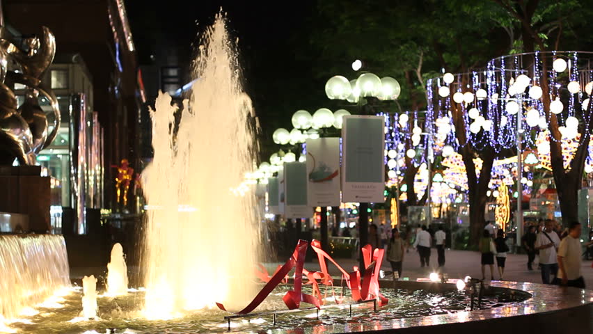 SINGAPORE - NOVEMBER 16: Fountain and Christmas light-up at night on Orchard Road, Singapore on November 16, 2009. The emblematic Orchard Road is famous for shopping and its lavish Christmas decor. Shallow DOF.