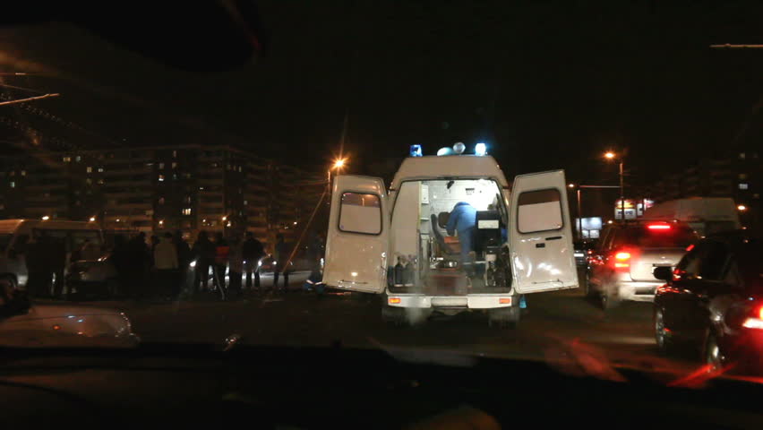 Ambulance car stands on the road near the accident 