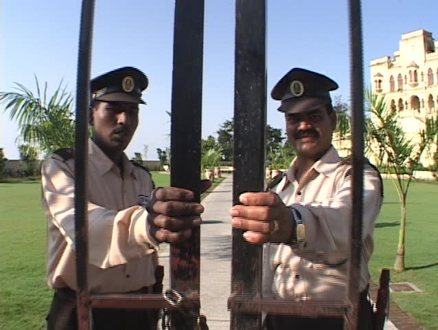guards open the palace gates.