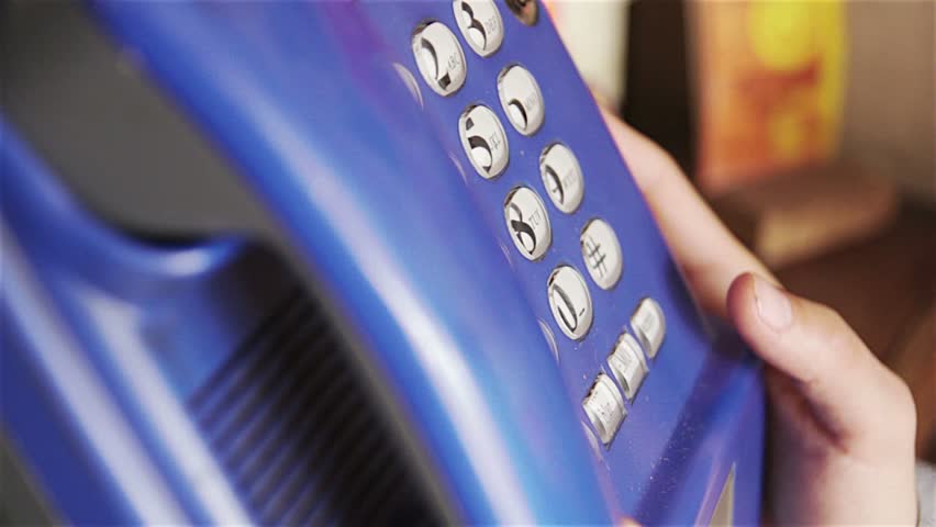Girl dialing and call from public telephone