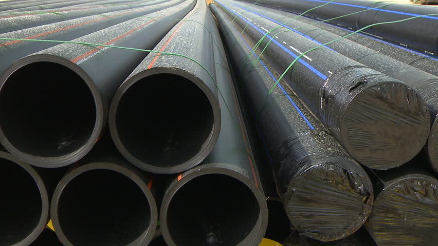 Pipes in construction site dolly shot