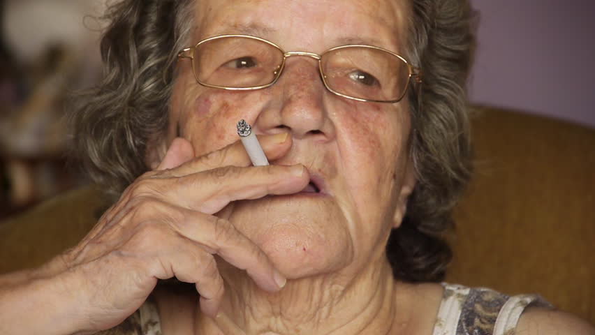 Old retired woman smoking cigarette - Unhealthy - Lifestyle - Addiction - Full HD