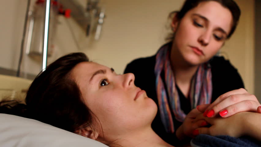 woman chucking a patient's hand