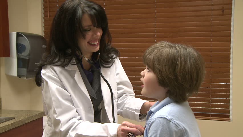 Female nurse checks child's breathing