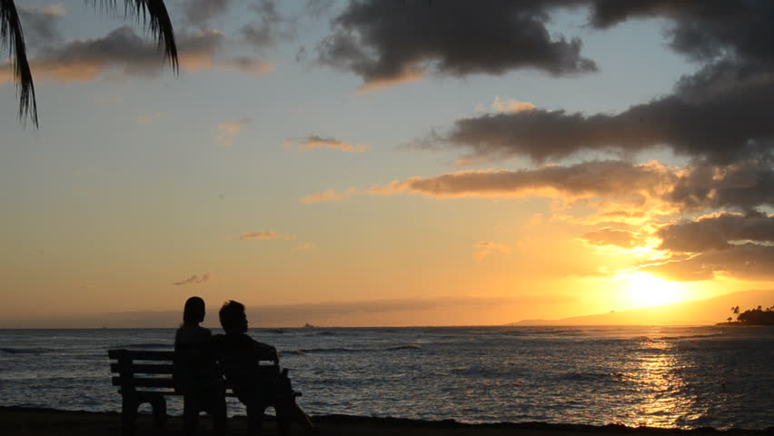 Romantic Couple At Sunset By The Beach