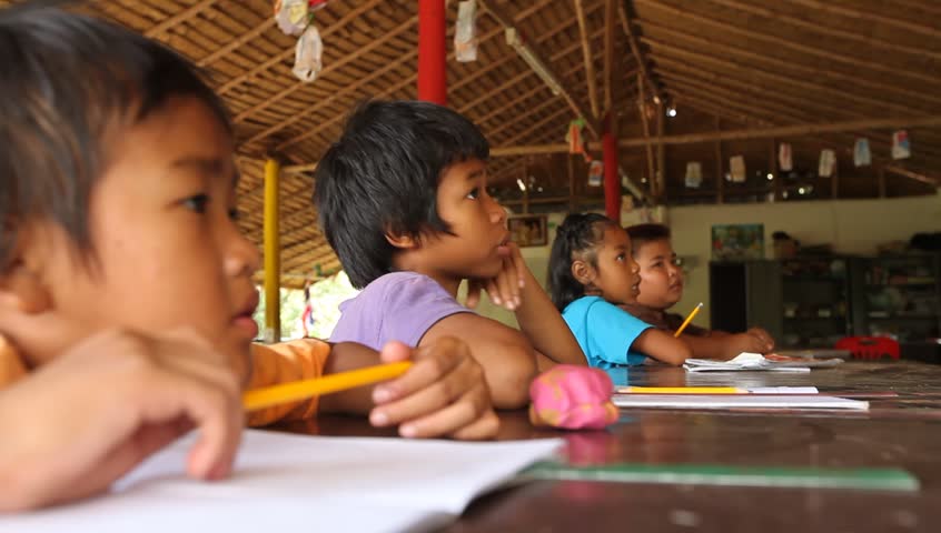 KO CHANG, THAILAND - FEBRUARY 7: Unknown children in lesson at school on February 7, 2012 on Ko Chang, Thailand. Cambodian Kids Care is an organization that helps deprived children in deprived areas with education.