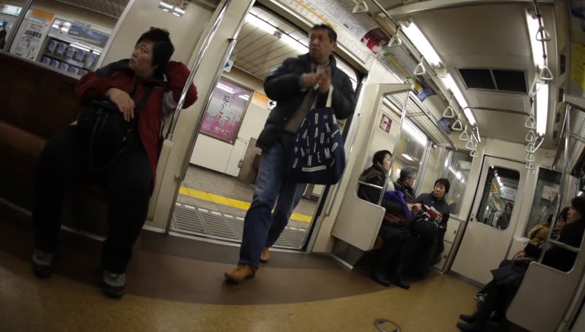 TOKYO - FEBRUARY 4: Unidentified passengers riding a subway train in Tokyo, Japan on February 4, 2011. Tokyo Metro is the most used subway system in the world in terms of annual passenger rides.