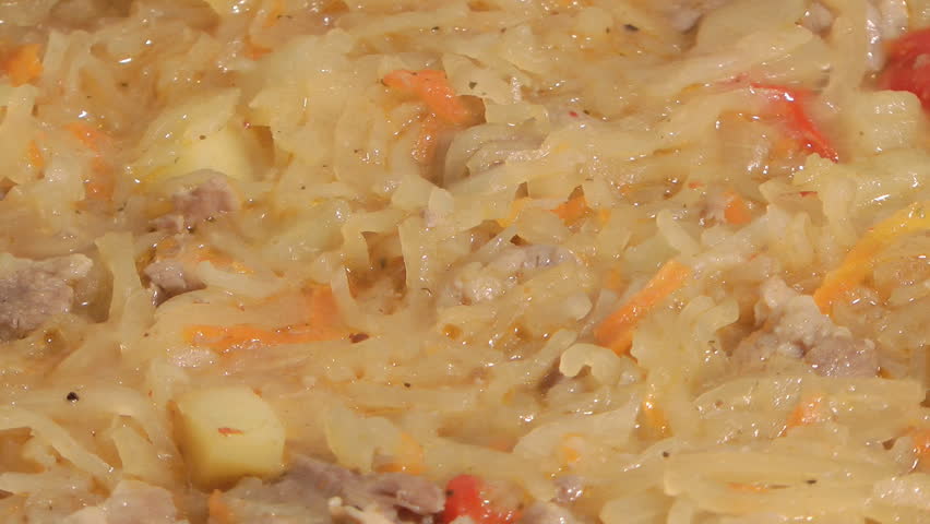 Dish of stewed meat and cabbage with spices.