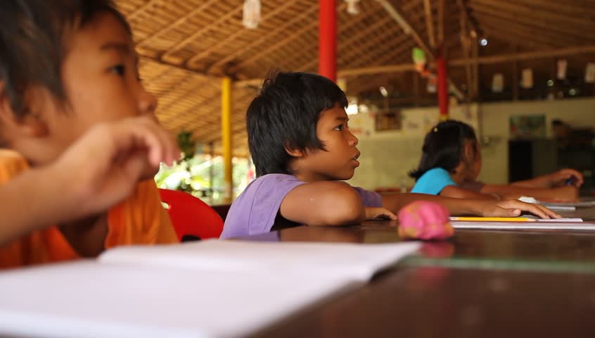 KO CHANG, THAILAND - JANUARY 6: Students learning in a school sponsored by Cambodian Kids Care, January 6, 2012 in Ko Chang, Thailand. Cambodian Kids Care is a program that provides kindergartners in deprived areas with education. 
