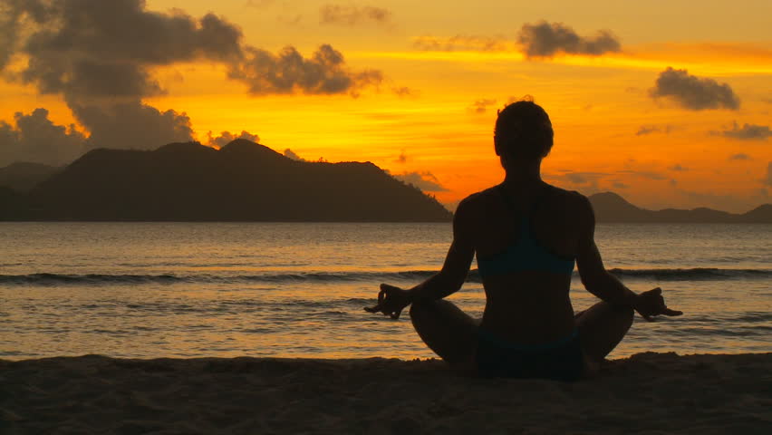 Silhouette Of A Beautiful Yoga Woman In The Morning On A