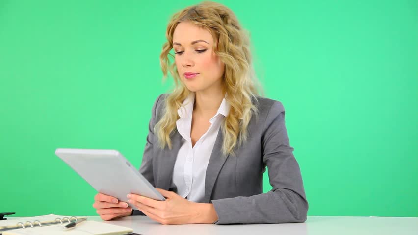Businesswoman working on electronic tablet