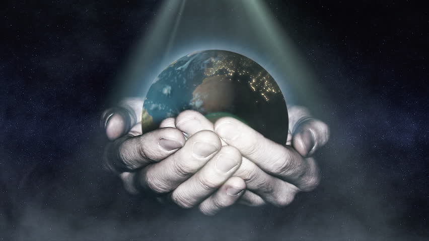 Man holding a rotating globe in his hands.