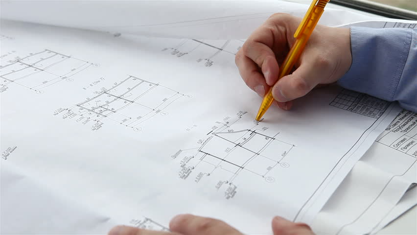 engineer checks the construction drawings