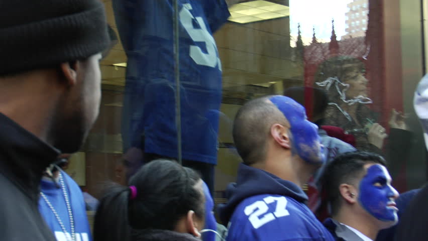 NEW YORK - FEBRUARY 7: Fans watch ticker-tape parade in honor of the Super Bowl Champions New York Giants on February 7, 2011 in New York. 