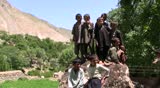 BADAKHSHAN, AFGHANISTAN - JULY 9: Young boys gather outside their school on July 9, 2010 in Badakhshan, Afghanistan. They are the first generation in their community to receive an education. 