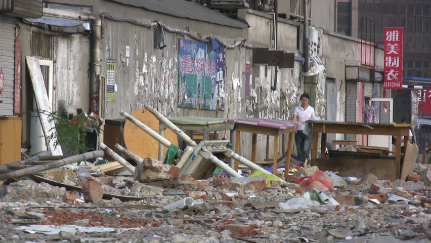 QINGDAO - JUNE 12: People are walking past a demolished quarter on June 12, 2010 in Qingdao, China.