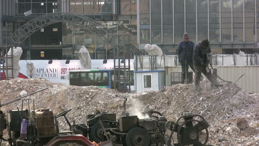 QINGDAO - MARCH 19: Workers are drilling at a construction site on March 19, 2010 in the city centre of Qingdao, China.