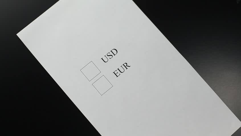 Hand choosing "EUR" in a questionnaire form