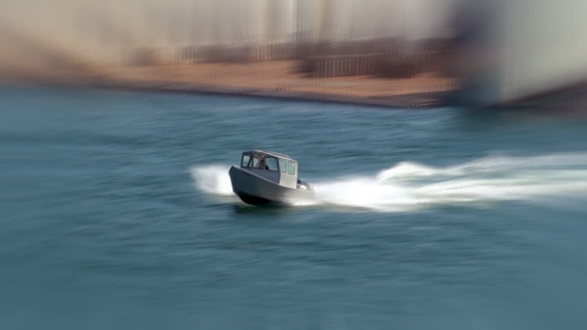 Small boat in ocean inlet