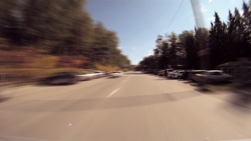 View from the window of a windshield of quickly moving car