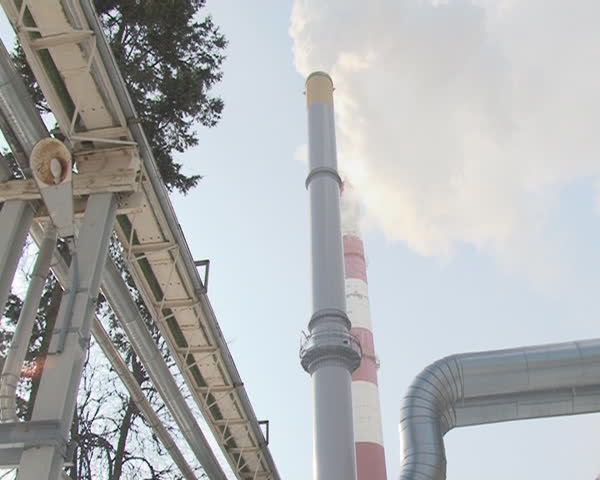 Smoke reek from chimney into sky and heat supply pipelines route.
