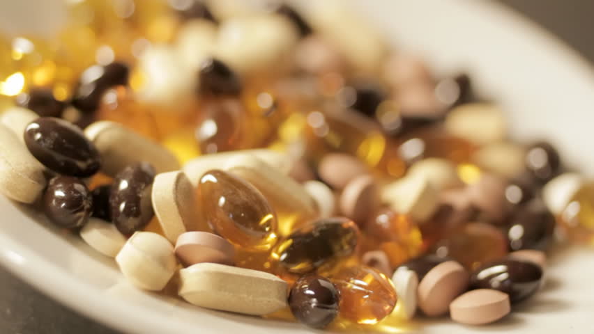 Plate of vitamin pills