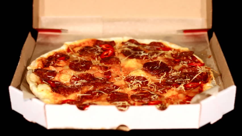 Hands of the people take to pizza, which have right before delivered
