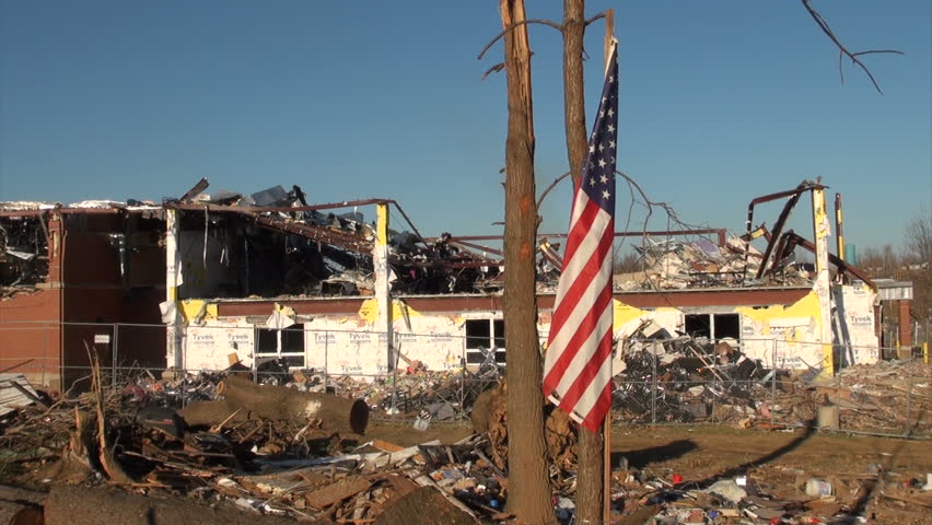 HENRYVILLE, IN - USA, MARCH 10, 2012- An American flag flies over the rubble in Henryville, IN, nearly a week after an EF-4 tornado struck the community on March 2, 2012. 
