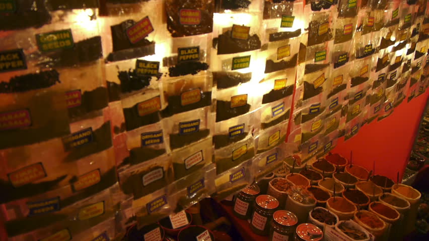 Spices lined in a row in an east asian market 