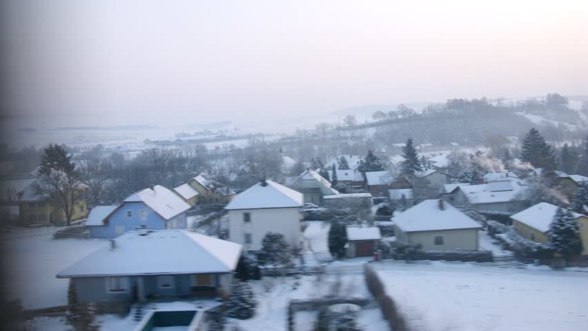 Train goes by rail near with inhabited locality, railway station, time lapse
