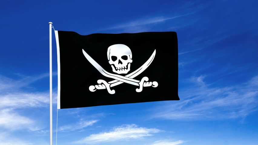 Jolly Roger pirate flag waving over a blue sky.