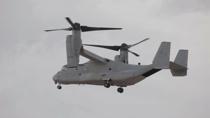 ST GEORGE, UTAH - MARCH 17: Aircraft V-22 Osprey VTOL hover during low landing approach doing vertical takeoff and landing video on March 17, 2012 in St. George, Utah. USAF, Marines, Navy and NATO allies for transportation.