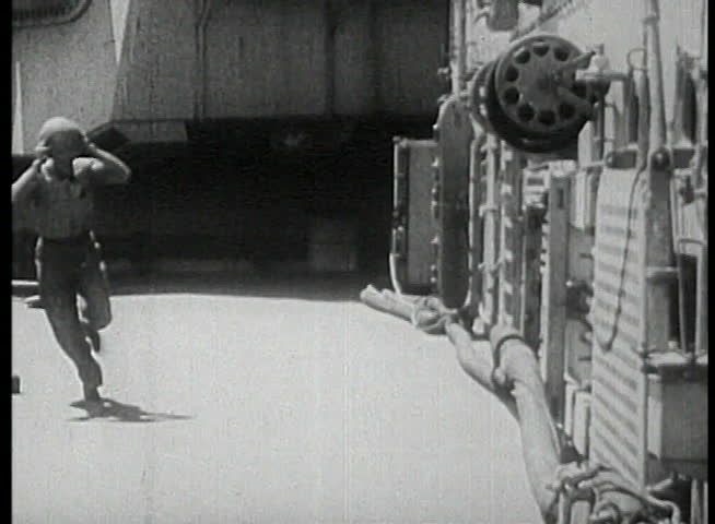 Sailors lined up to pass ammunition