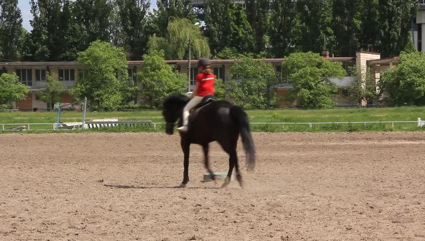 A girl riding equestrian style