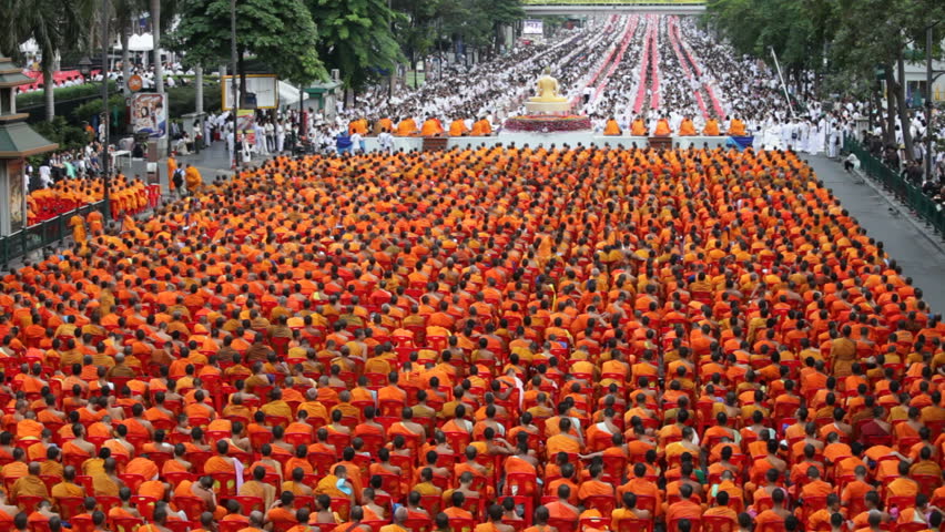 Monks are participating in a Mass Alms Giving of 12,600 monks in Central World for the Makha Bucha celebrations in Bangkok, Thailand