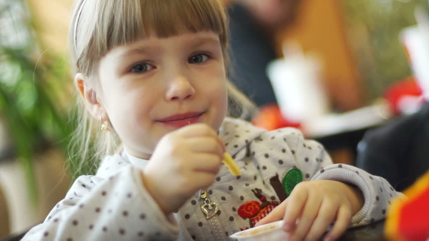 Child eating a french fry