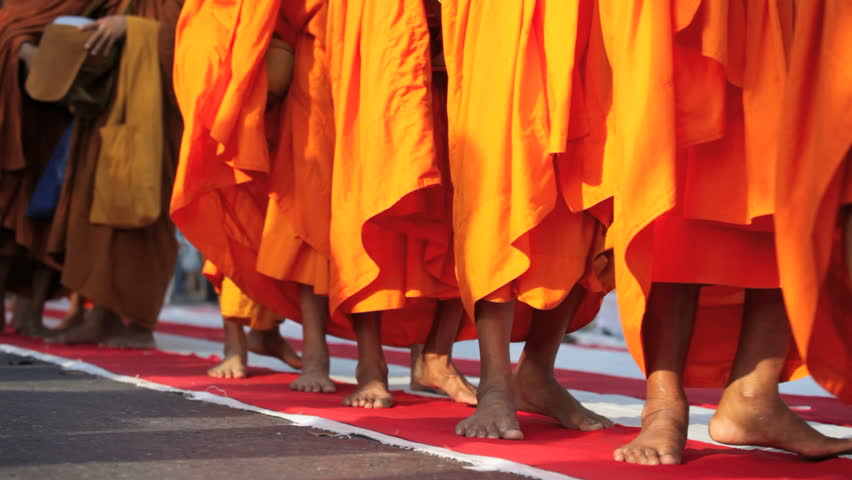 BANGKOK, MARCH 25, 2012: Monks are participating in a Mass Alms Giving of 12,600 monks in Central World for the Makha Bucha celebrations in Bangkok, Thailand