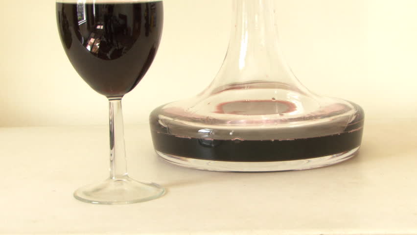 MEDIUM SHOT PAN WINE GLASS AND DECANTER
