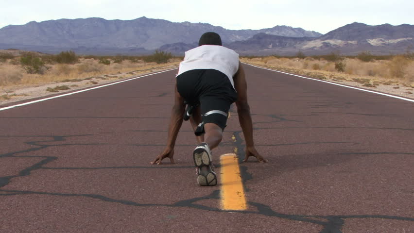 Male runner getting ready to sprint