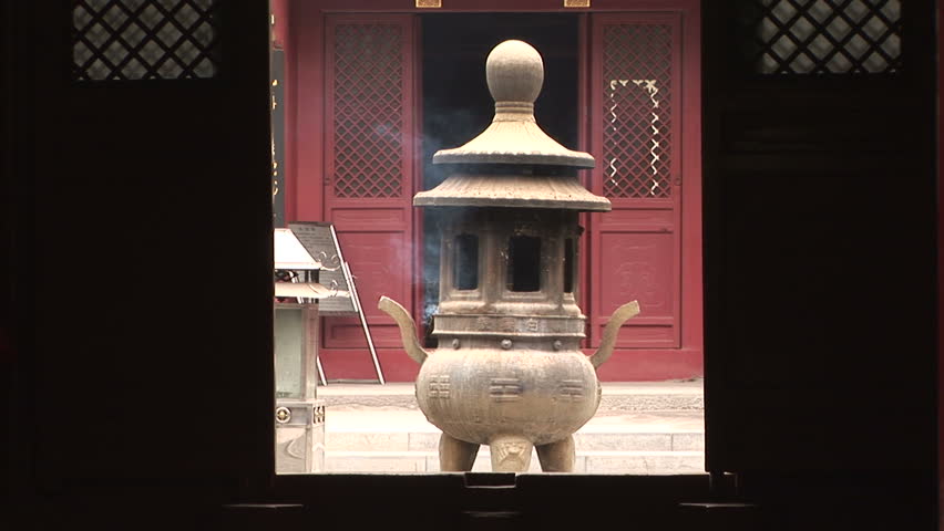 Bronze pagoda incense burner through door, White Cloud Temple, world's oldest Taoist temple, Beijing, China, zoom out.