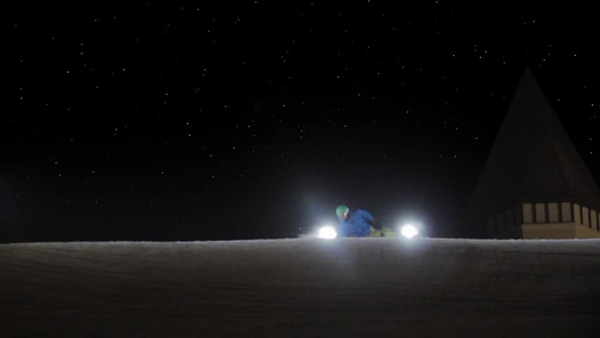 HD super slow motion. Snowboarding in night.