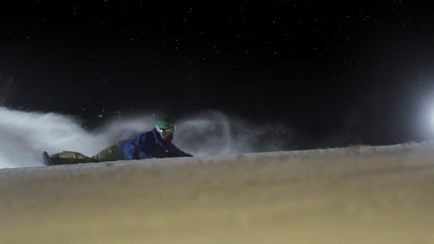 HD super slow motion. Snowboarding in night.