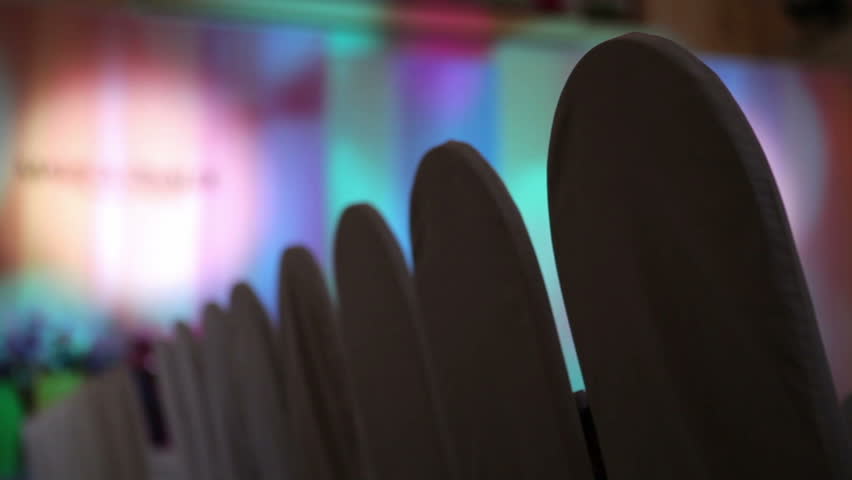 Hall with empty chairs and spots of the light. Before the beginning of the fashion show