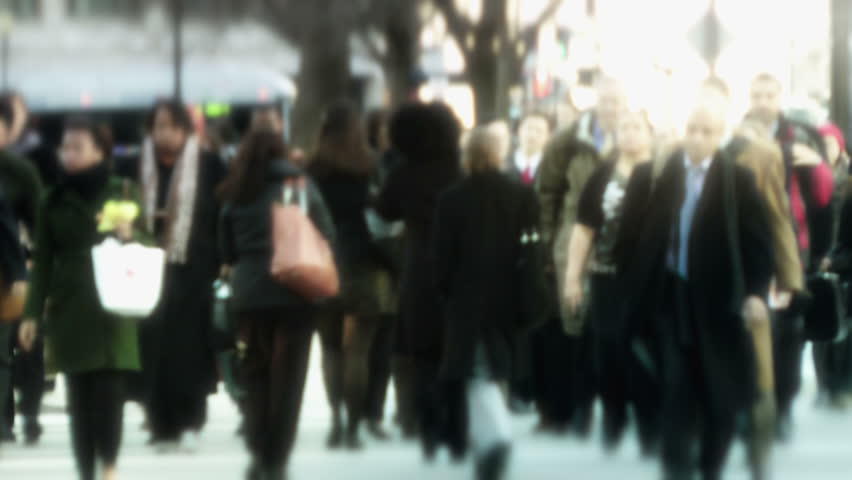 WASHINGTON, D.C. â FEBRUARY 15:  Defocused crowd of evening urban commuters hurry across K St. near Connecticut Ave. in downtown D.C. on February 15, 2012. This is one of DC's busiest intersections.