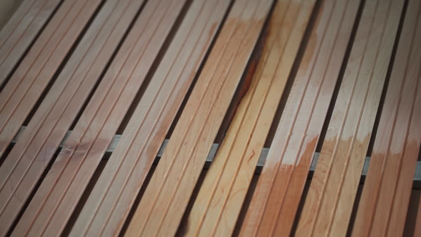 a painter beginning to paint a wood