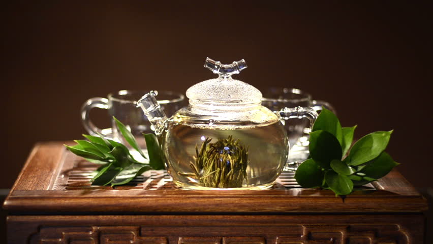 glass teapot with green tea flower