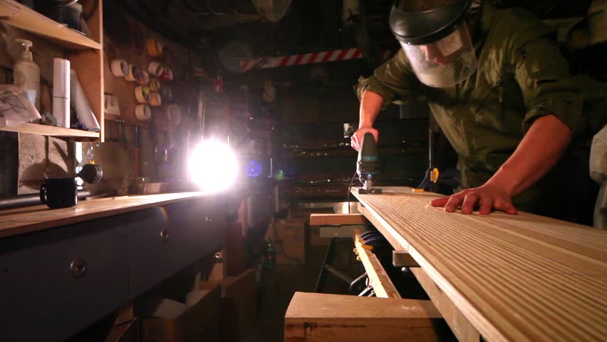 Workman in joinery workshop.