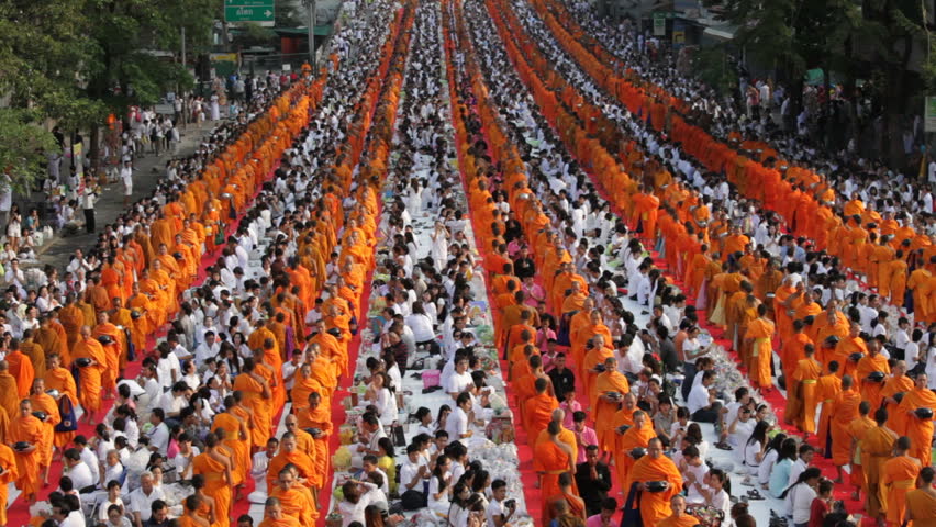 BANGKOK, MARCH 18, 2012: Monks are participating in a Mass Alms Giving of 12,600 monks for the Makha Bucha celebrations in Bangkok, Thailand on March 18, 2012. 