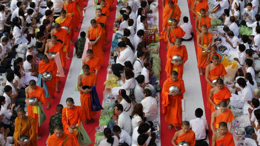 BANGKOK, MARCH 18, 2012: Monks are participating in a Mass Alms Giving of 12,600 monks for the Makha Bucha celebrations in Bangkok, Thailand  on March 17, 2012. 